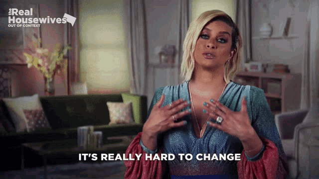 a woman says it 's really hard to change in a living room