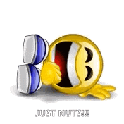 a yellow smiley face with a fist in the air and the words `` just nuts '' .
