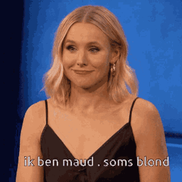 a woman in a black dress is smiling with the words ik ben maud soms blond below her