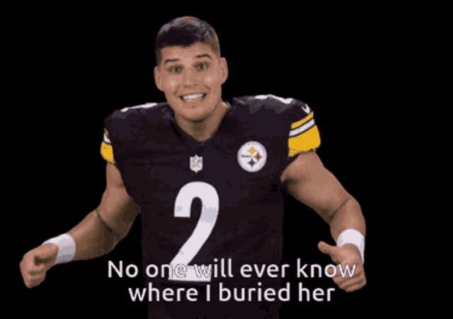 a man in a number 2 jersey giving a thumbs up