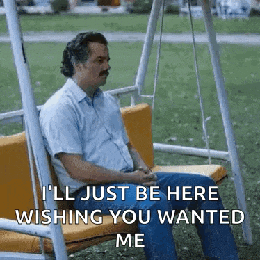 a man is sitting on a swing and says `` i 'll just be here wishing you wanted me ''