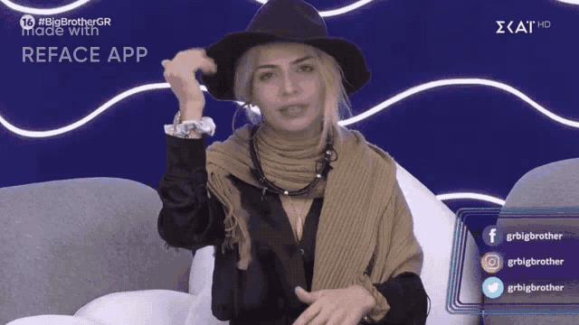a woman wearing a hat and scarf is sitting on a couch in front of a big brother gr reface app