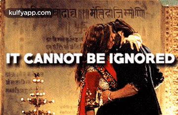 a couple kissing with the words it cannot be ignored behind them
