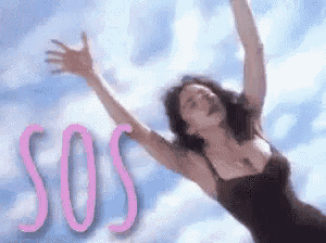 a woman in a black dress is flying through the air with her arms outstretched and the word sos in pink .