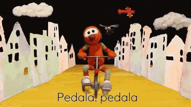 a cartoon character is riding a bicycle with the words pedala pedala written below him