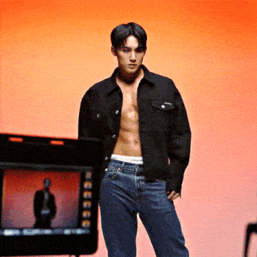 a shirtless man with calvin klein underwear on his pants