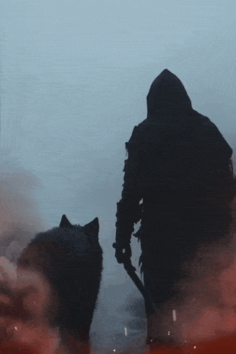 a man in a hood is walking a dog