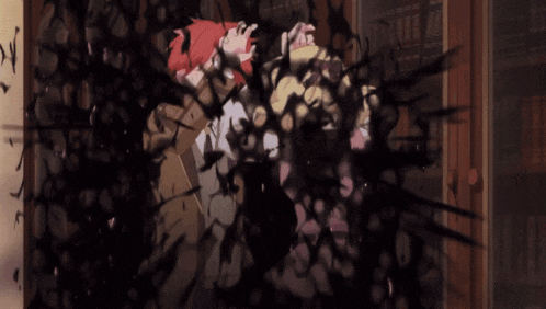 a boy and a girl are standing in front of a book shelf
