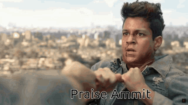 a man in a denim jacket with the words praise ammit on the bottom