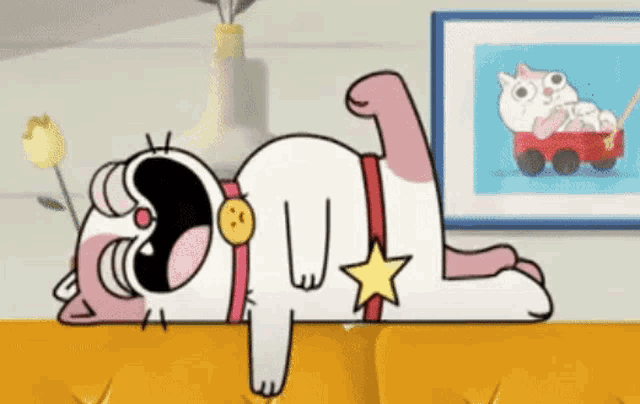 a cartoon cat is laying on its back on a couch with a gold medal around its neck .