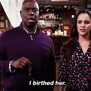 a man and a woman are standing next to each other with the man saying i birthed her