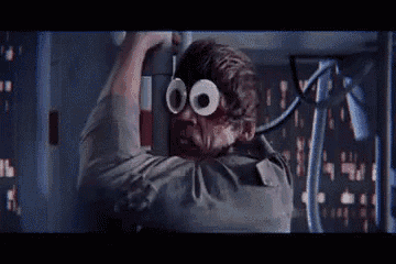 a man wearing a pair of googly eyes is hanging from a rope .