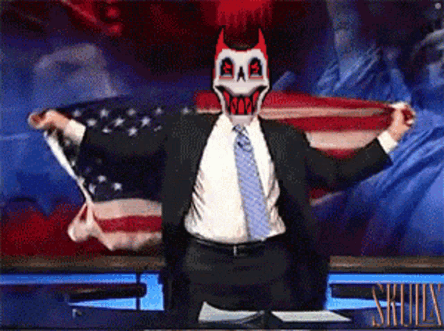 a man in a suit and tie is holding an american flag in front of a skulls logo