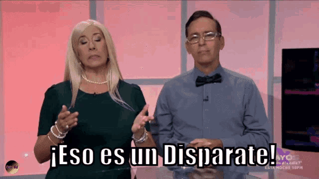 a man and a woman standing next to each other with the words eso es un disparate written on the screen