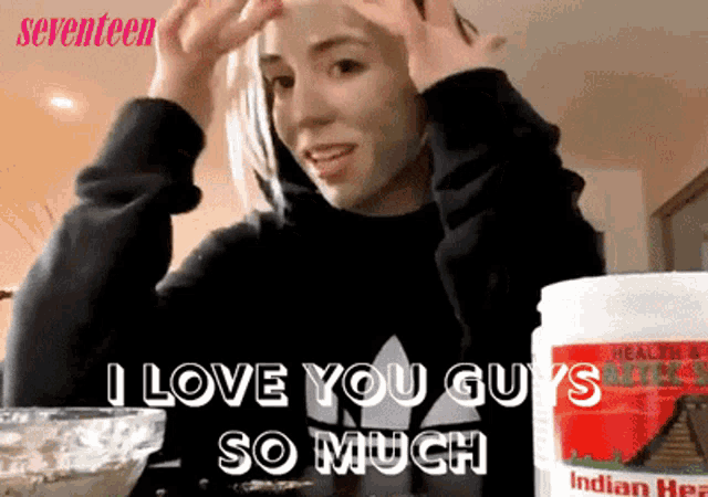 a woman is wearing a mask and says i love you guys so much