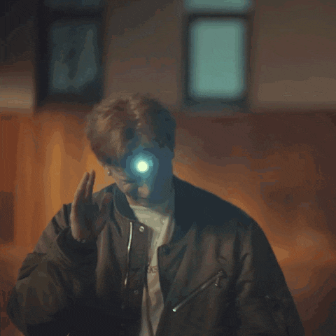 a man is taking a picture of himself in the dark