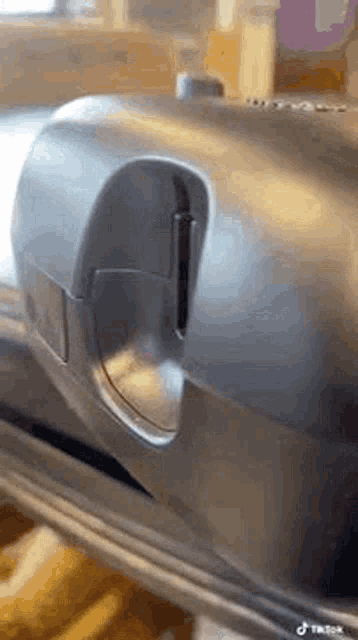 a close up of a machine that is being used to make a sandwich .