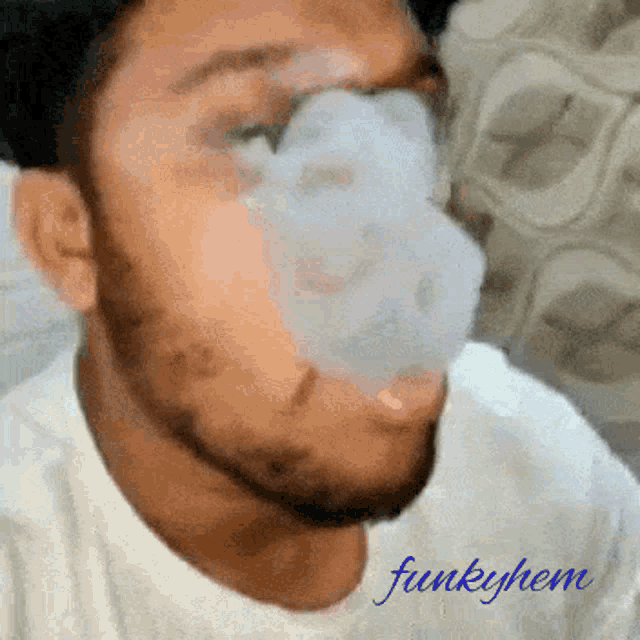 a man smoking a cigarette with the name funkyhem written on the bottom right