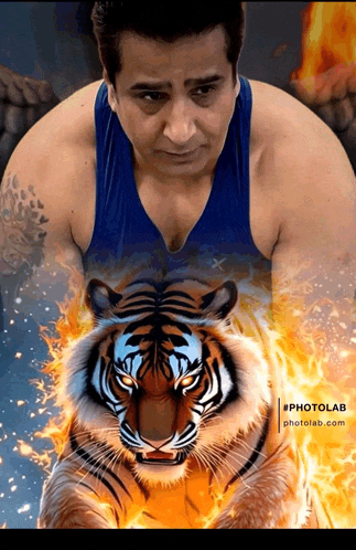 a man in a blue tank top stands next to a tiger