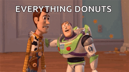 woody and buzz lightyear from toy story are standing next to each other looking at donuts .
