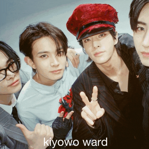 a group of young men posing for a picture with the name kiyowo ward written on the bottom