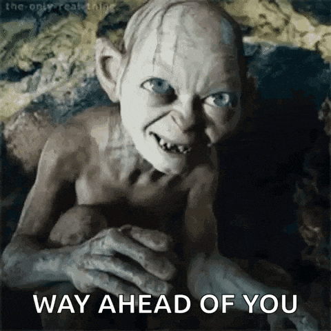 gollum from the lord of the rings is smiling and looking at the camera .