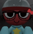 a close up of a cartoon character wearing glasses and a blue sweater .