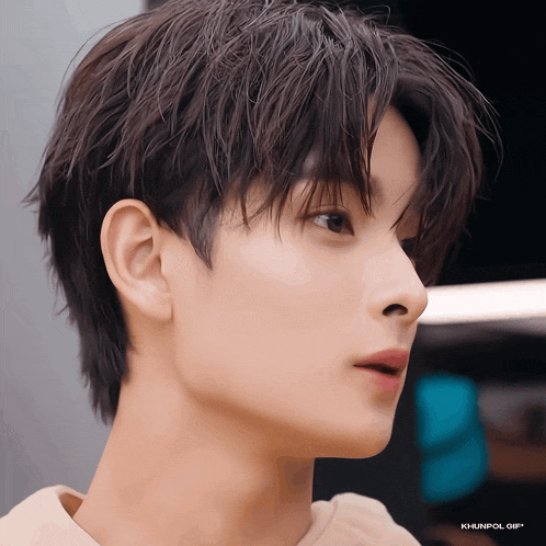 a close up of a man 's face with the words khunpol gif written below it