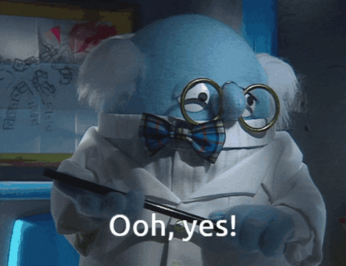 a muppet wearing glasses and a bow tie says " ooh yes "