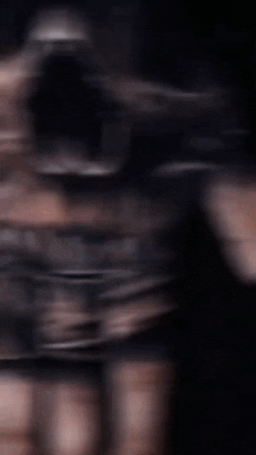 a blurry image of a person 's hand with a skull on it