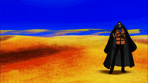 a man in a black cape stands in the desert