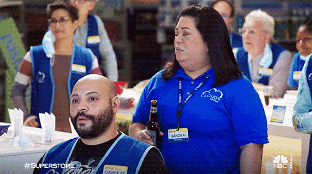 a man and a woman wearing blue shirts that say clouds