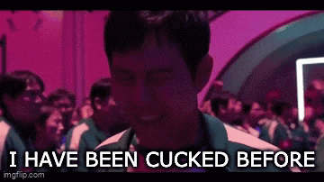 a man is standing in front of a crowd with the words `` i have been cucked before '' written on the screen .