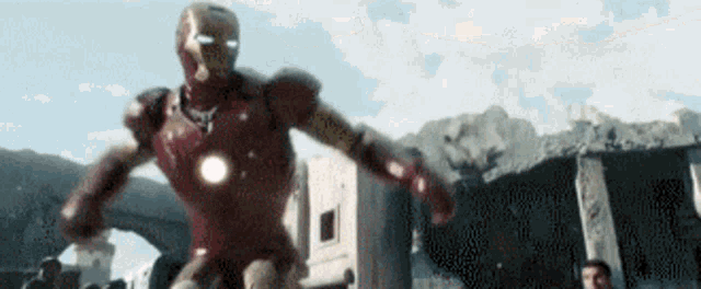a man in a red iron man suit is running