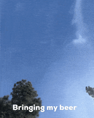 a blue sky with trees in the foreground and the words bringing my beer on the bottom