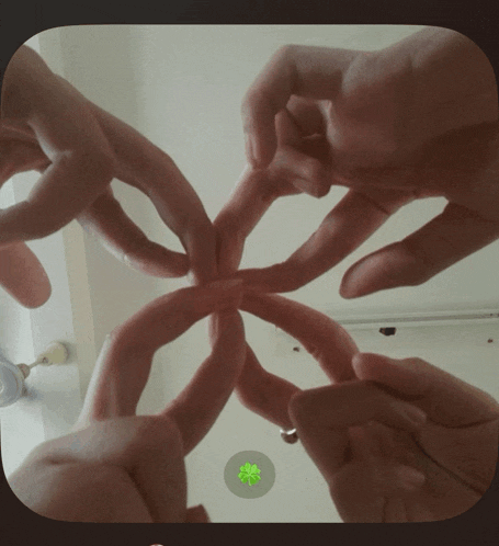 a group of hands making a circle with their fingers