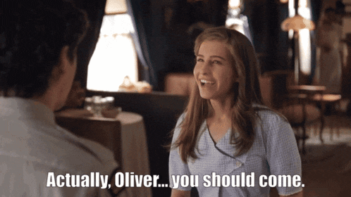a woman is smiling and talking to a man who says actually oliver you should come