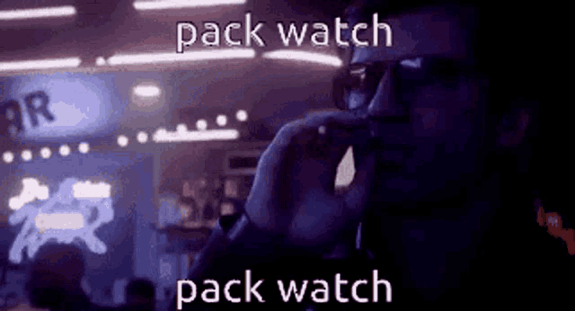 a man wearing sunglasses is smoking a cigarette in a dark room with the words pack watch pack watch on the bottom