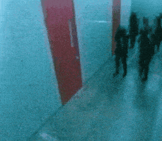 a blurry picture of a group of people in a room