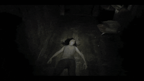 a woman in a mask is standing in a dark room with the words " leave me " on the bottom