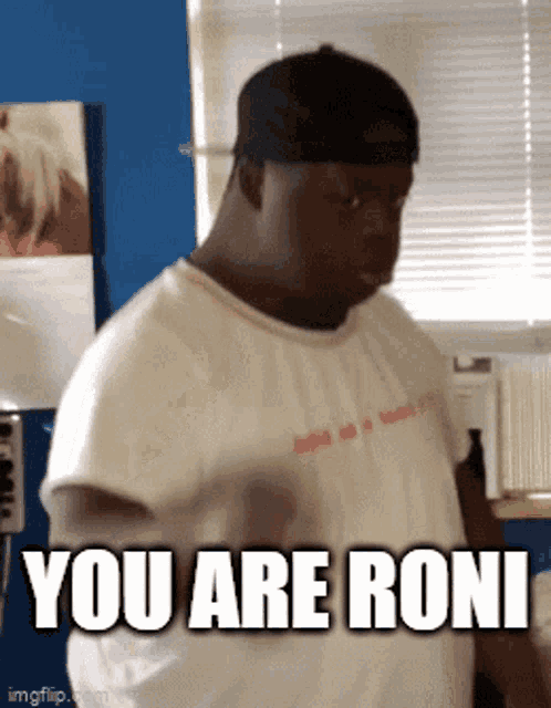 a man wearing a baseball cap and a white shirt says " you are roni "