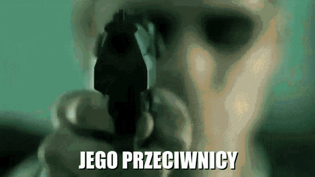 a man is pointing a gun at the camera with the words " jego przeciwnicy " written below him