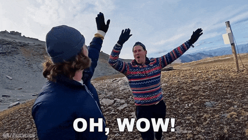 a man in a sweater is giving a high five to another man with the words oh wow written below him