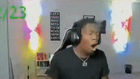 a man wearing headphones is dancing in a room with a lot of lights .