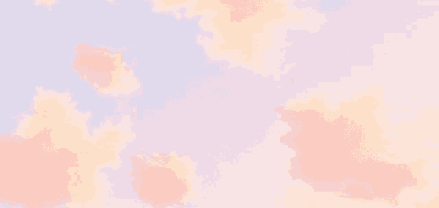 pink clouds in a blue sky with a few trees in the background