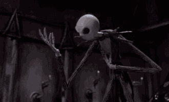 jack skellington from the nightmare before christmas is standing in a dark room with his mouth wide open .