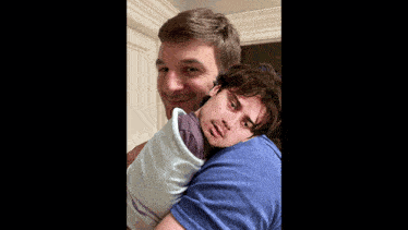a man holding a baby with the words who 's your daddy