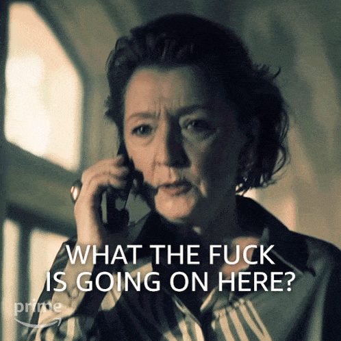 a woman talking on a phone with the words " what the fuck is going on here "