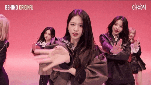 a group of girls are dancing in front of a pink background that says behind original choom