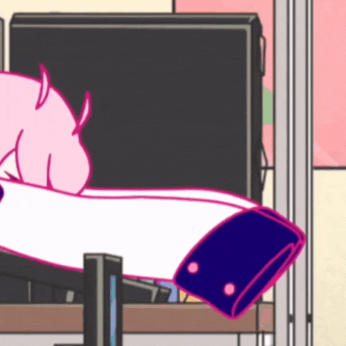 a cartoon character with horns is sitting in front of a computer monitor